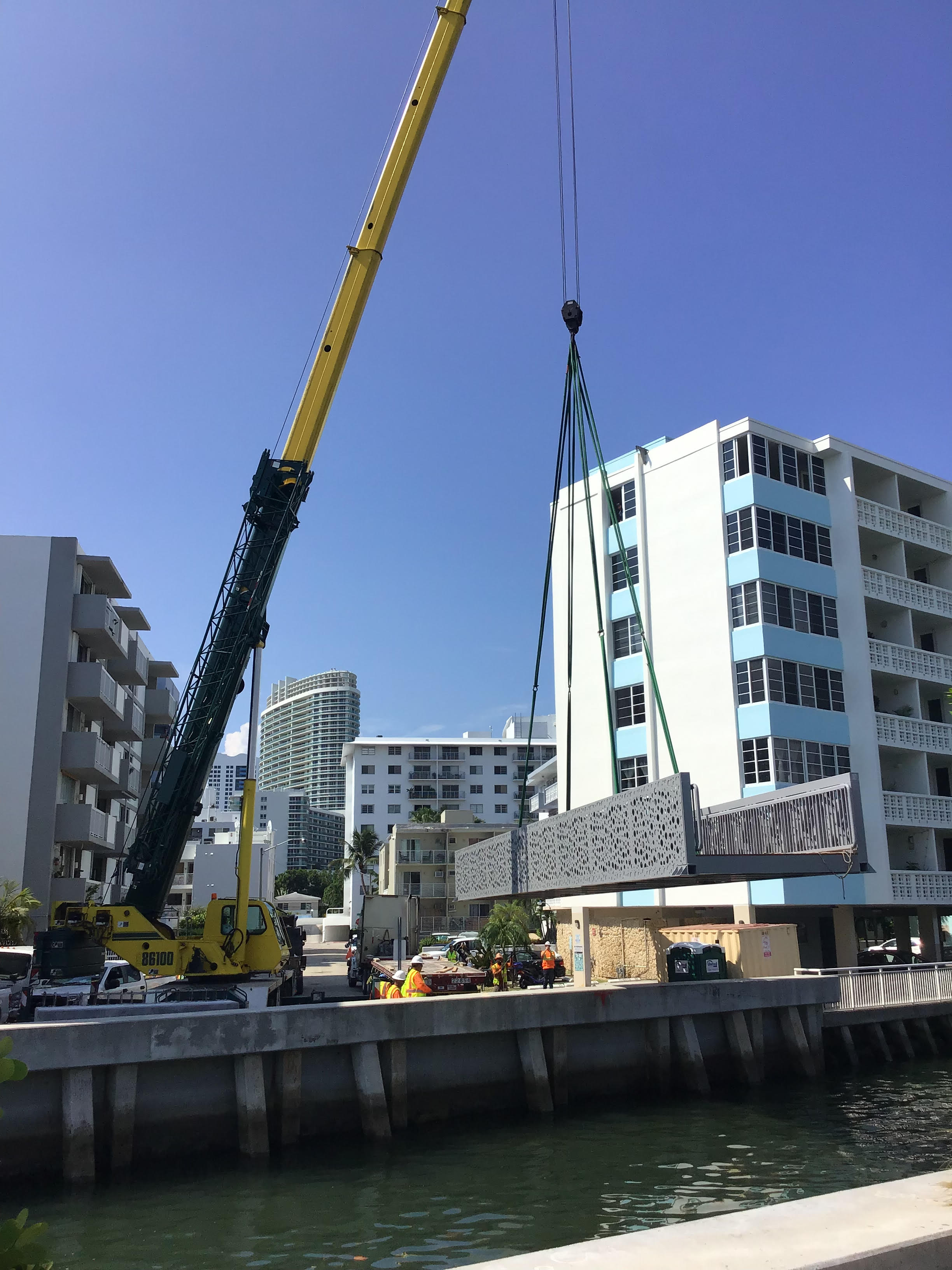 Bergeron crew uses a crane to set the pedestrian bridge at West Avenue and Collins Canal in Miami Beach completing the Design Build project.