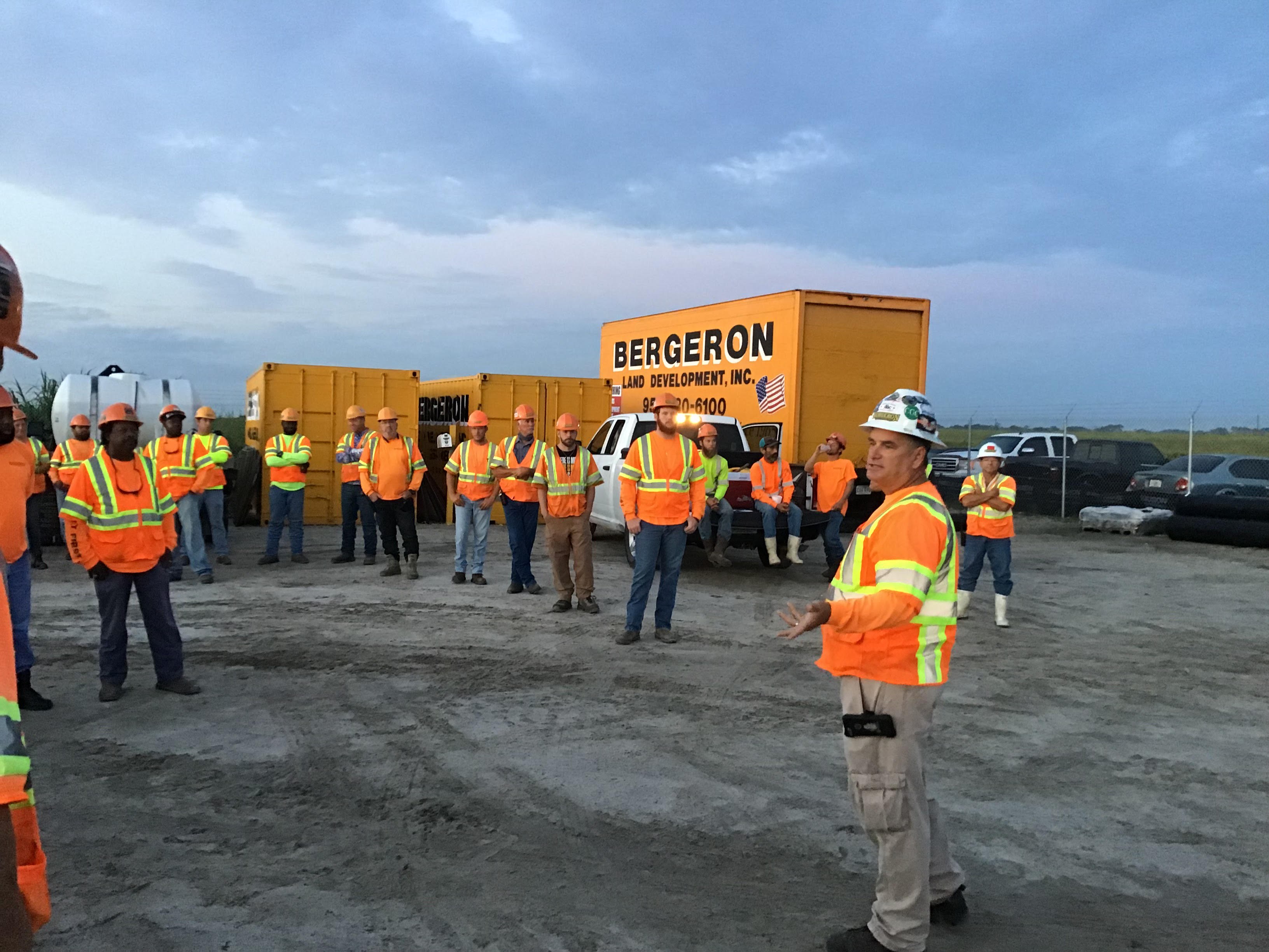 Bergeron Land Development employees start the day with a safety meeting at a roadway construction or site development project.
